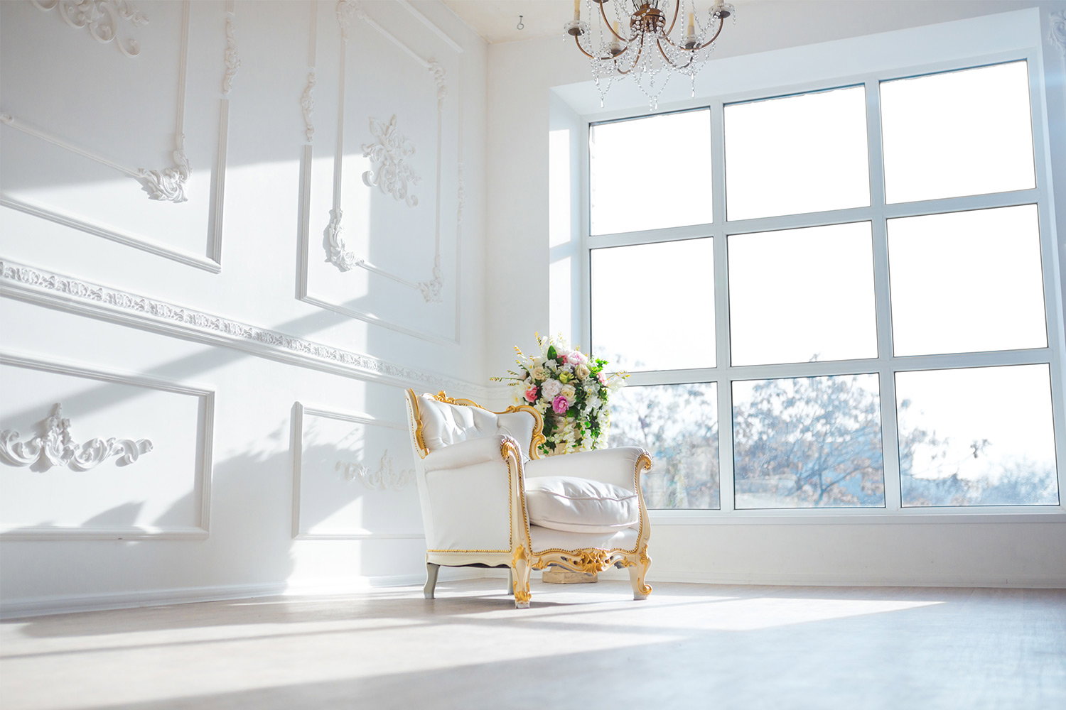 large white spring room with white chair and big windown