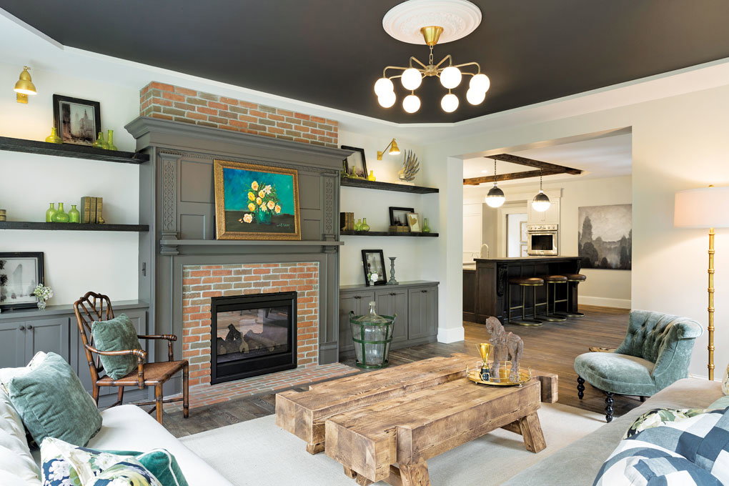 The living room features a two-sided fireplace, reclaimed and painted mantel, and ceiling medallion.