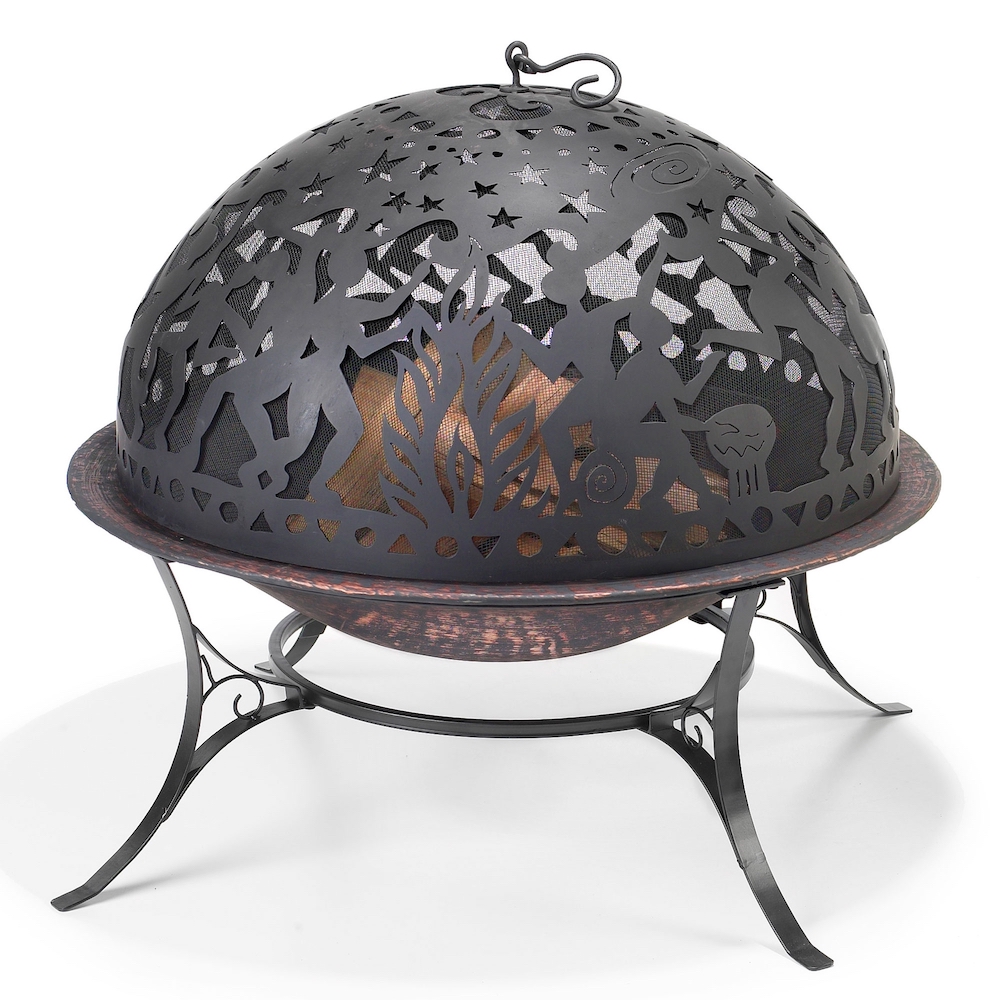 A fire pit with a protective spark screen featuring a whimsical image.