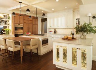 Engler Studio – Eden Prairie A kitchen in Eden Prairie designed by Linda Engler and Jenn Taft of Engler Studio featured on the 2017 ASID Kitchen Tour. White cabinetry is accented by a light-colored wood dining table with cream-colored counter stools surrounding it.