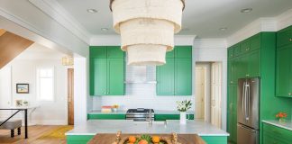 An all white kitchen with kelly green-colored cabinets.