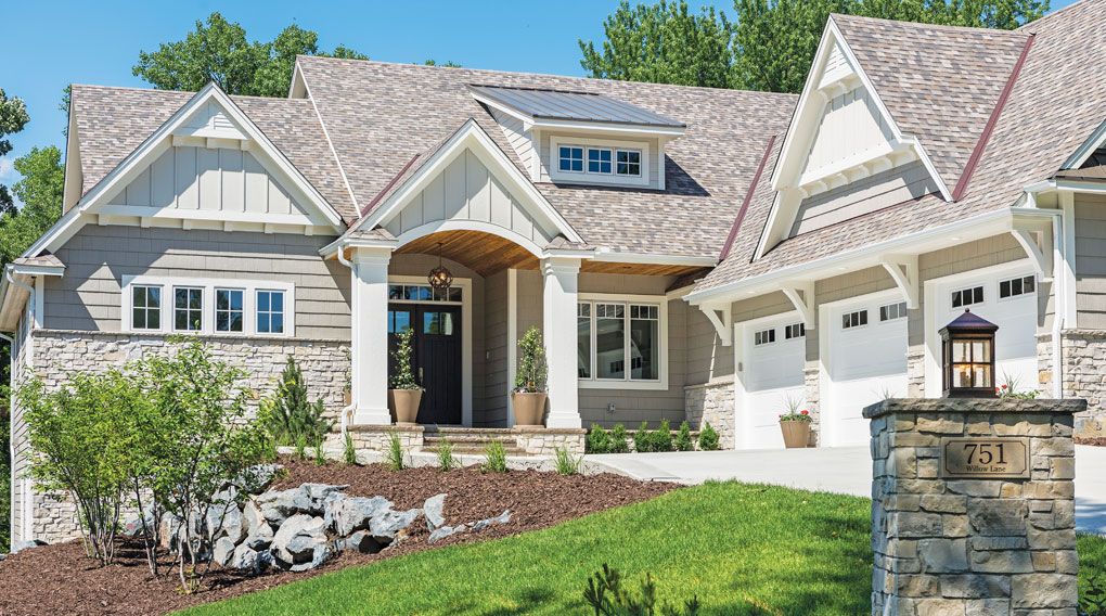 img_2017-08_Luxury-Home-Tour_M-And-M-Home-Contractors_Exterior_G The exterior of a cottage-style home built by M & M Home Contractors.
