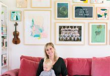 Inside Erin Kate Duininck’s Excelsior Home Kate Duininck holds her baby and dog on couch in her Excelsior Home