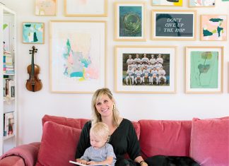 Inside Erin Kate Duininck’s Excelsior Home Kate Duininck holds her baby and dog on couch in her Excelsior Home