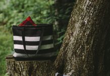 Faribault Woolen Mill Introduces Great-for-Gifts Goods Patterned totes by Faribault Woolen Mill sitting on a tree stump.