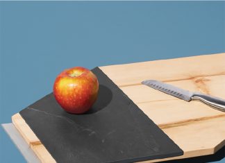 Tandem Made A cutting board by Tandem Made with an apple and knife resting on it.