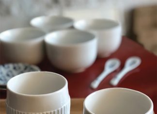 Umei Boutique’s Japanese Housewares Japaense cups and spoons by Umei Boutique sitting on a table.