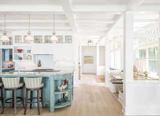 TEA2 Architects Craft Lake Minnetonka Cottage The classic kitchen, with its painted island and cozy booth, evokes the cottage character the couple envisioned.