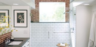 DiGiacomo Homes Gives a Bathroom a User-friendly Update A curbless shower with a strip drain makes the shower more accessible, and continuous large-format floor tile makes the space feel larger in a bathroom designed by Digiacomo Homes.