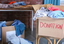 Spring Cleaning Hacks Donation box with clothing on wooden chair