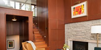 2018 Luxury Remodeling Tour: Bella Custom Homes Photo of renovated living room with fireplace by Bella Custom Homes.