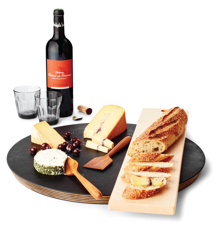 A cheese platter with accompanying wine.