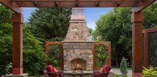 Asian-Inspired Landscape Evolves with Homeowners’ Preferences Living walls of herbs and vegetables frame the outdoor fireplace.