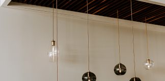 Glass pendants by Hennepin Made hanging from the ceiling.