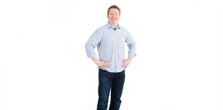 Photo of a man standing against a white background