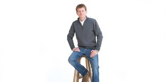 Stonewood, LLC Photo of a man sitting on a wooden stool