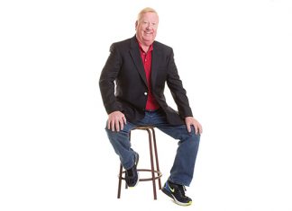 2019 Builder: TJB Homes Photo of a man sitting on a wooden stool