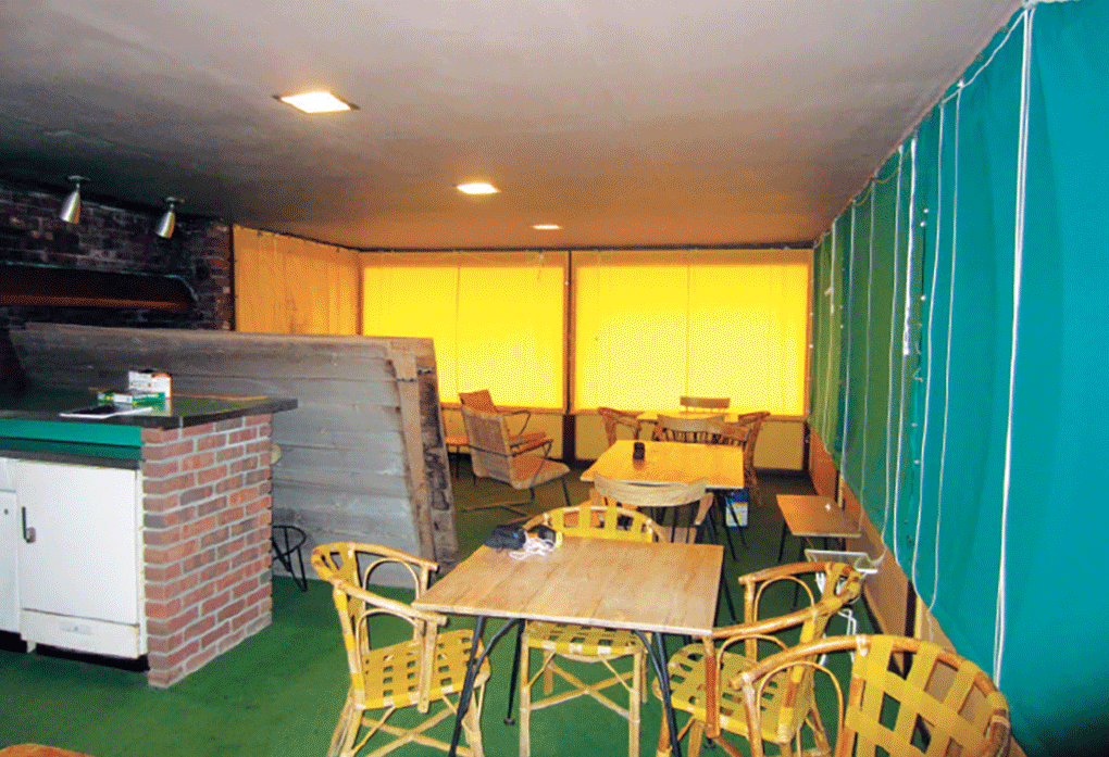 A gif showing the before and after of a renovated boathouse.