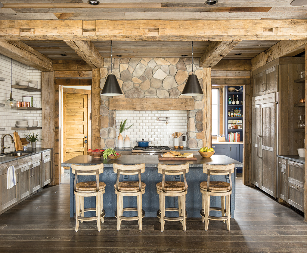 White subway tile and open shelving helps the windowless kitchen feel open and light.