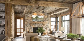 The open living spaces are tied together with reclaimed wood beams, posts, and ceilings.