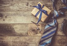 Father's day concept - present, tie on rustic wood background