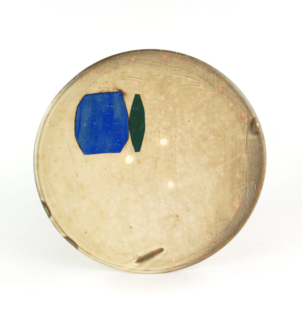 ceramic dinner plate with small blue and green detail