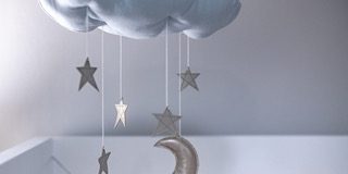Local Designer Creates a Lasting Spark in a Celebrity Nursery cloud baby mobile with stars and moon