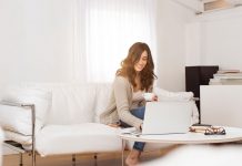 A woman sitting on her couch using her laptop for online shopping at Solid Manufacturing Co. and more.