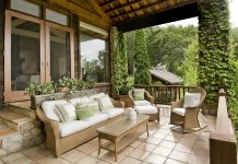 Give Your Patio a Facelift A beautiful patio with seating and plenty of greenery in the background.