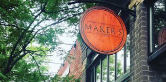 Makers on the Lake Ryan and Suzanne Huggett, owners of The Makers Studio, outside its storefront in Excelsior, Minnesota.