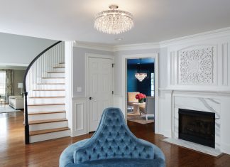 Life in Color Clean white panels and a glossy dark wood floor provide the perfect backdrop for this elegant, blue-accented space designed by Martha O’Hara Interiors.