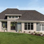 Inspired by mountain lodges commonly seen in the western United States, this new Lake Elmo home features high ceilings, reclaimed beams, and metal railings. Part of Midwest Home's 2018 Luxury Home Tour.