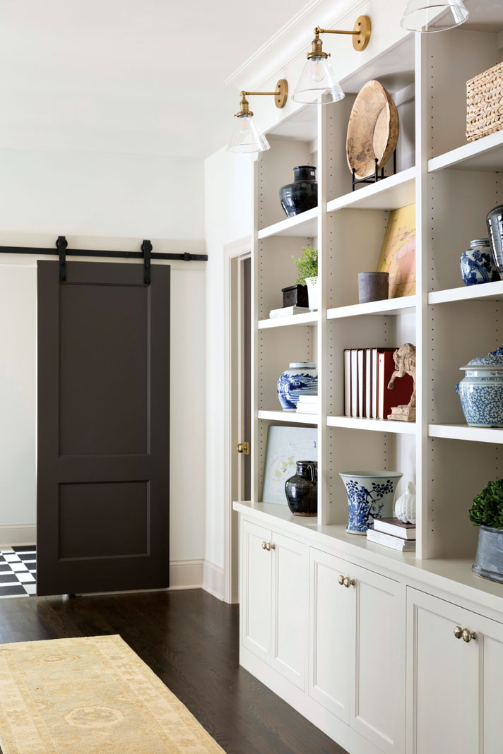 Built-in cabinetry in the upstairs hall provides useful storage space. Part of Midwest Home's 2018 Luxury Home Tour.