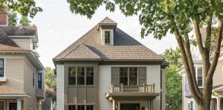 Timeless Designs Designed to seamlessly blend in among its historic neighbors, the new home’s exterior features double-hung windows and a front portico topped by a balustrade. Part of Midwest Home's 2018 Luxury Home Tour.