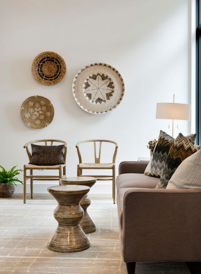 A living room of a home on Midwest Home's 2018 Luxury Home Tour that features seating, and artwork on the walls.