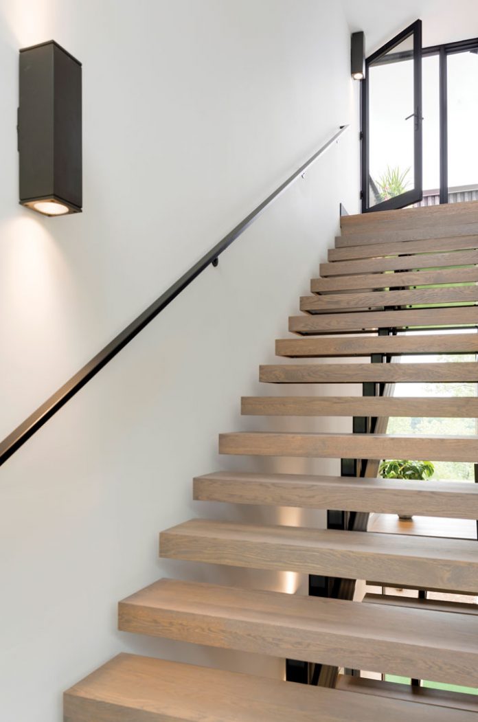 A stairwell connection the lower and upper levels of a home on Midwest Home's 2018 Luxury Home Tour.