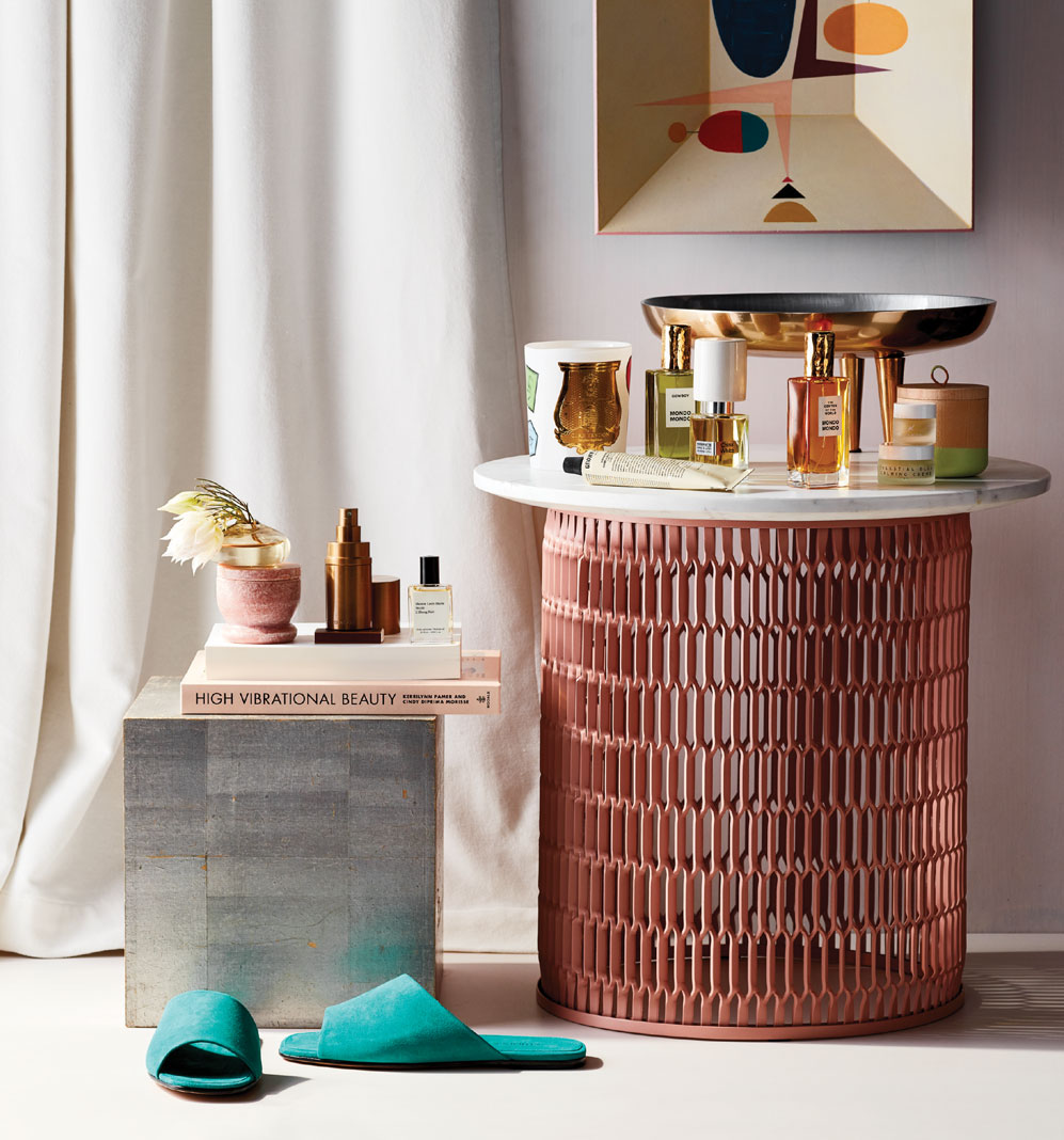 A collection of items in the Holiday Gift Guide that includes sandals, perfume, painting, and more.