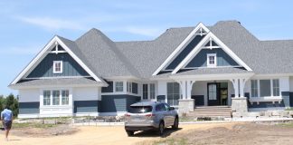 Sneak Peek: 2020 Luxury Home Tour The gables and columns give just a hint of the traditional molding and details of this new build.