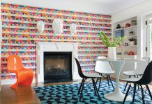 A Home Makeover Sparked by Style A bright and bold book-covered wallpaper steals the spotlight in the playroom.