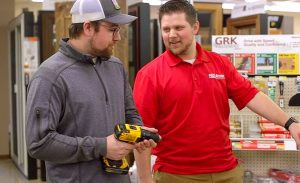 A store associate helping a customer