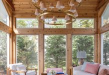 Midwest Design’s Top 5 Featured Projects in 2025 The existing home’s new 275-square-foot pine sunroom features a patterned sofa and powder blue cocktail table, a pair of 1960s French bamboo chairs, and a two-tiered chandelier in antique burnished brass that dangles overhead.