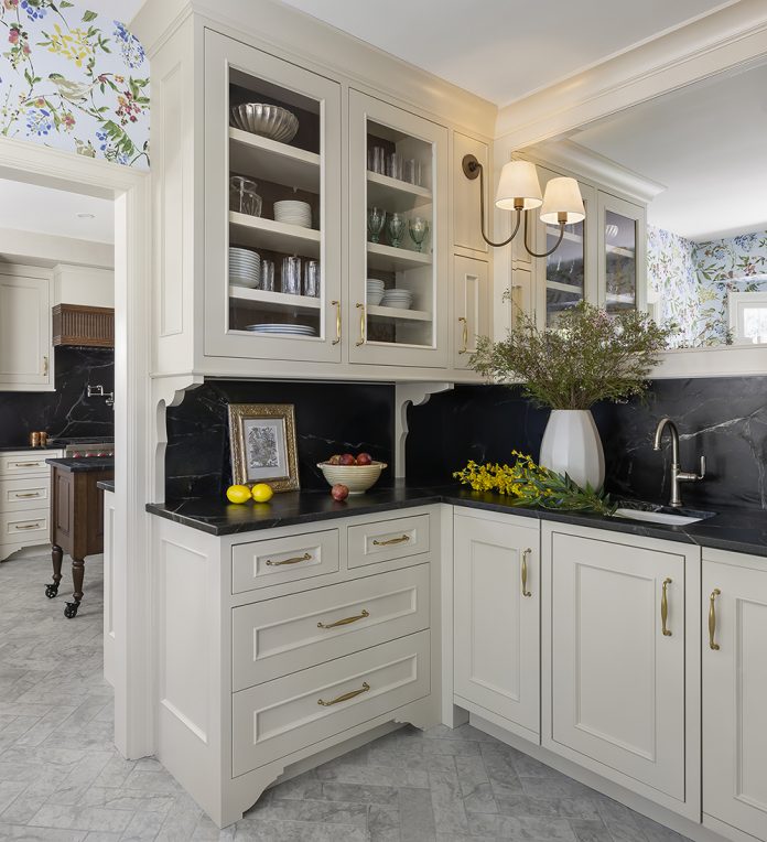 Butler's pantry in high end traditional kitchen with large mirror