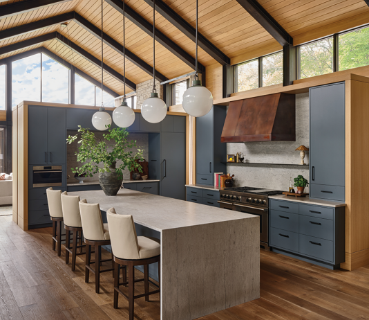 Rehkamp Larson Architect wood vaulted ceiling with large island dining table