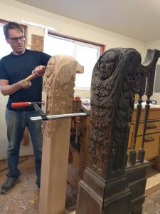 Erik Wyckoff carves newel posts for the historic Foley mansion.