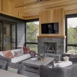 House Dressing Company large living room porch with wood and stones