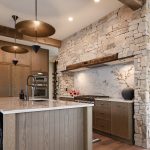 Mountain Living Redefined: A Buyer’s Guide The kitchen in Sapphire Summit features wood from floor to ceiling, including reclaimed wood beams from Manomin Resawn Timbers.