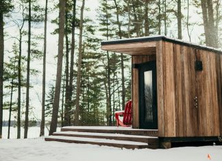 A Custom Sauna Brings Year-Round Warmth to Northern Minnesota A snow covered cabin overlooking trees