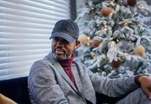 Houston White is pictured in the living room of one of the units in Camdentown Flats, his latest housing development project in North Minneapolis.