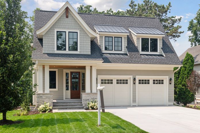 light gray home with two car garage