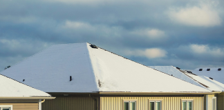 midwest home with snow on roof